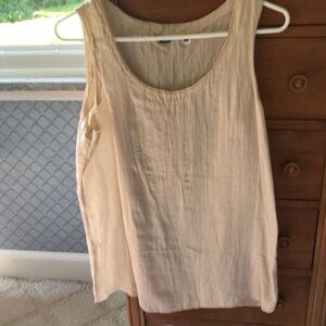 Golden cast creamy sleeveless scooped neck tank with textured sheen fabric.